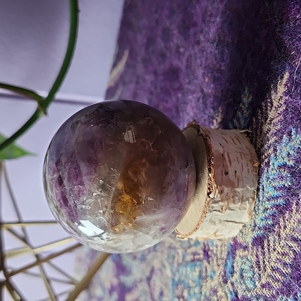 Amethyst Sphere Crystal on birch tree cut stand.